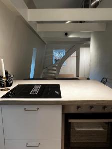 a kitchen with a sink and a staircase at Two Bedroom, Newly Renovated, Garden Apartment in Gärsnäs, Österlen in Gärsnäs