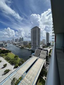 a view of a river and a city with buildings at 23rd floor Luxury & Spacious BeachWalk Resort Apartment with Amazing View in Hallandale Beach