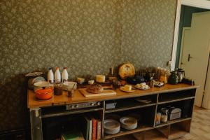 a kitchen with a counter top with dishes on it at Turistgården Särna in Särna