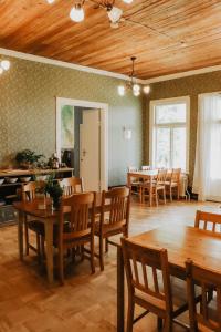 a dining room with wooden tables and chairs at Turistgården Särna in Särna