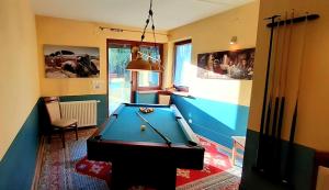 a billiard room with a pool table in it at To Tu Dom in Brenna