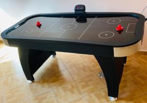 a ping pong table with two balls on it at ANNABERG Polanica Zdrój in Polanica-Zdrój