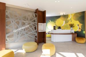 The lobby or reception area at Auberge de Clochemerle, Spa privatif & restaurant gastronomique