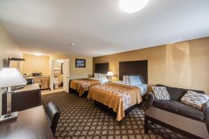 Ένα ή περισσότερα κρεβάτια σε δωμάτιο στο Relax Inn and Suites Kuttawa