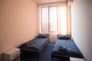 Ліжко або ліжка в номері Si-Yo hostel