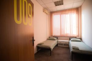 Ліжко або ліжка в номері Si-Yo hostel
