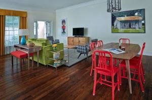 a dining room and living room with a table and chairs at Hotel Abacus in Athens