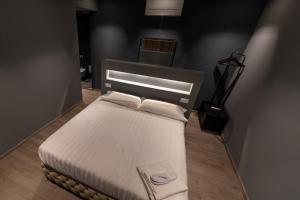 Postel nebo postele na pokoji v ubytování DiVino Rooms Deluxe