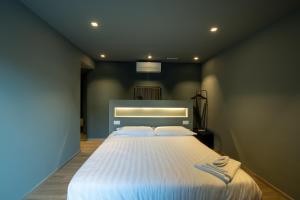 Postel nebo postele na pokoji v ubytování DiVino Rooms Deluxe