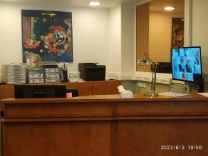 an office with a desk with a computer on it at Hotel Geoffroy Marie Opéra in Paris