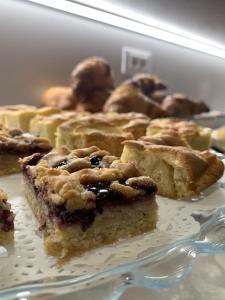 a close up of a plate of food with pie at MAR60 Apartments in Caorle