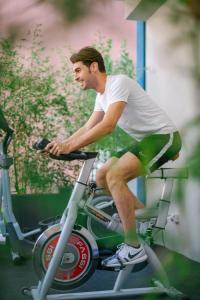 a man is riding a bike on a scooter at MAR60 Apartments in Caorle