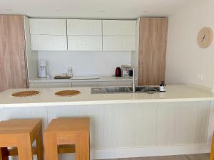 a kitchen with a sink and a counter at The View in Bora Bora