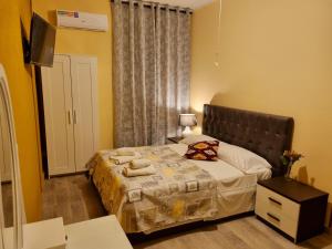 Postel nebo postele na pokoji v ubytování Rose Guest House