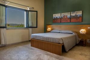 Postel nebo postele na pokoji v ubytování Hotel Poggio Bertino + 37 fotografií