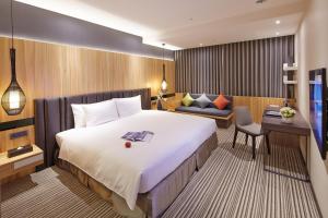 Postel nebo postele na pokoji v ubytování La Vida Hotel