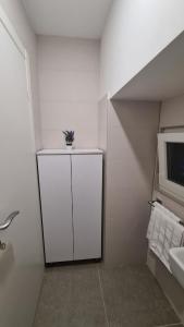 Televízia a/alebo spoločenská miestnosť v ubytovaní Gold Luxury Room
