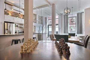 a chess set on a table in a room at GENERATIONS QUEBEC OLD CITY/ Parking/ Family in Quebec City