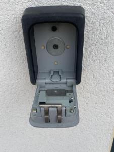 a electronic device is attached to a wall at Le Relais de la Gare in Dole