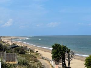 a view of a beach with the ocean at Tracy’s holiday home - static caravan in Hemsby