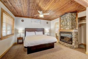 a bedroom with a bed and a fireplace at Heavenly Valley Lodge in South Lake Tahoe