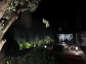 a building with a lit up sign on it at night at DARIC HOTELS in Atakum