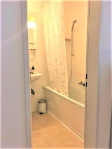 a bathroom with a shower and a toilet and a sink at Walenstadt in Seenähe B & B in Walenstadt