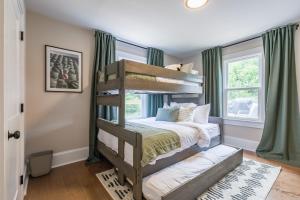a bedroom with a bunk bed and a window at Blue Haven ATL in Atlanta
