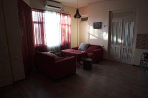 a room with two chairs and a table and a window at НордВест in Yerevan