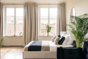 Postel nebo postele na pokoji v ubytování Bogoria Residence - LoftAffair Collection