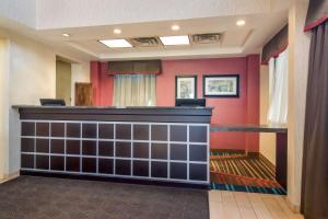 a bar in a room with red walls at Best Western Dutch Valley Inn in New Philadelphia +31 photos