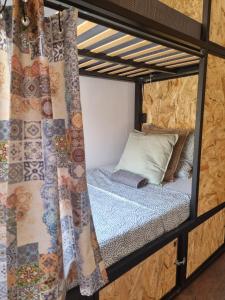 a bed in a bunk bed room with a window at St. António 49 in Faro