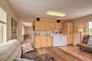 a living room with a couch and a kitchen at Charming Barn Apt in Boulder! Gateway to Parks! in Boulder Town