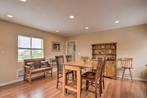 a kitchen and dining room with a wooden table and chairs at Charming Barn Apt in Boulder! Gateway to Parks! in Boulder Town