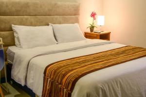Postel nebo postele na pokoji v ubytování Casa Lorenza Hotel