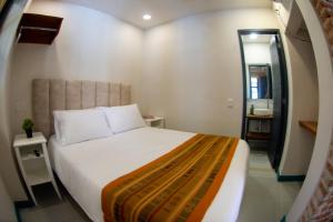 Postel nebo postele na pokoji v ubytování Casa Lorenza Hotel