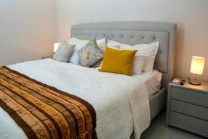 Postel nebo postele na pokoji v ubytování Casa Lorenza Hotel