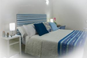 Postel nebo postele na pokoji v ubytování Casa Lorenza Hotel
