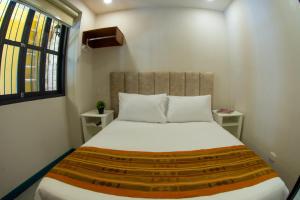 Postel nebo postele na pokoji v ubytování Casa Lorenza Hotel