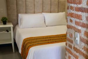 Postel nebo postele na pokoji v ubytování Casa Lorenza Hotel