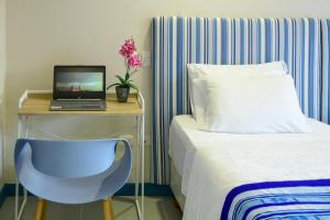 Postel nebo postele na pokoji v ubytování Casa Lorenza Hotel