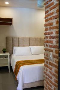Postel nebo postele na pokoji v ubytování Casa Lorenza Hotel