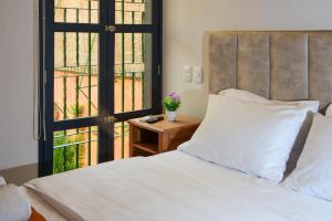 Postel nebo postele na pokoji v ubytování Casa Lorenza Hotel