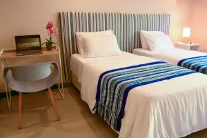 Postel nebo postele na pokoji v ubytování Casa Lorenza Hotel