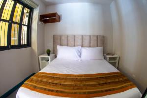 Postel nebo postele na pokoji v ubytování Casa Lorenza Hotel