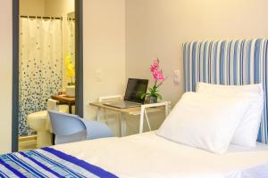 Postel nebo postele na pokoji v ubytování Casa Lorenza Hotel
