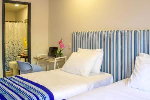Postel nebo postele na pokoji v ubytování Casa Lorenza Hotel