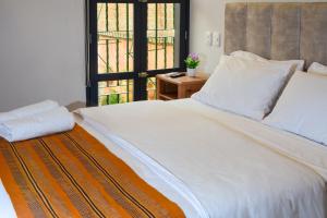 Postel nebo postele na pokoji v ubytování Casa Lorenza Hotel