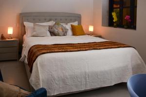 Postel nebo postele na pokoji v ubytování Casa Lorenza Hotel