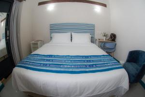 Postel nebo postele na pokoji v ubytování Casa Lorenza Hotel
